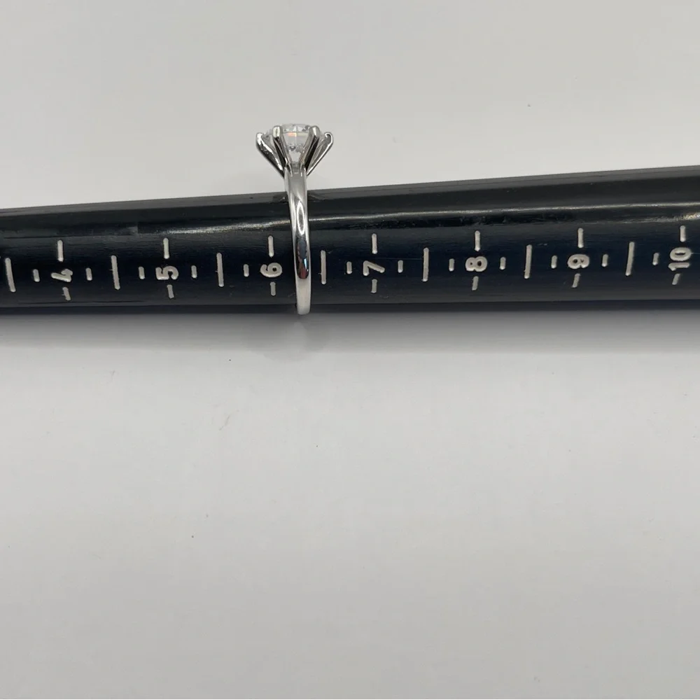 Two (2) carat cz solitaire in a 925 sterling silver setting. Size 6.25.